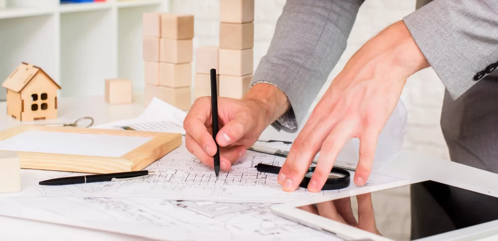 architect working with models beside