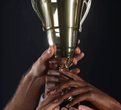 hands holding a trophy