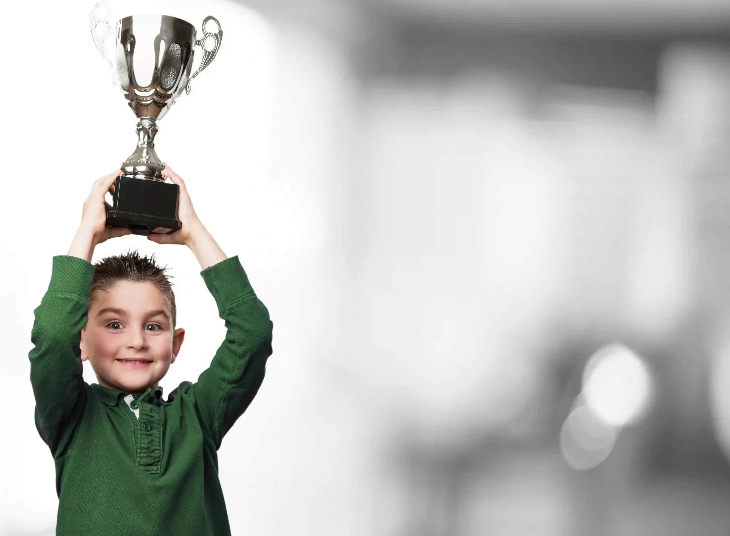 boy holding a trophy