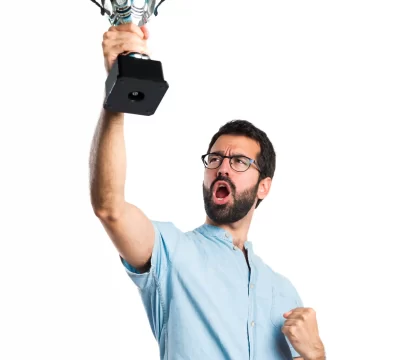 man raising a trophy
