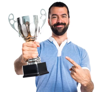 man holding a silver trophy