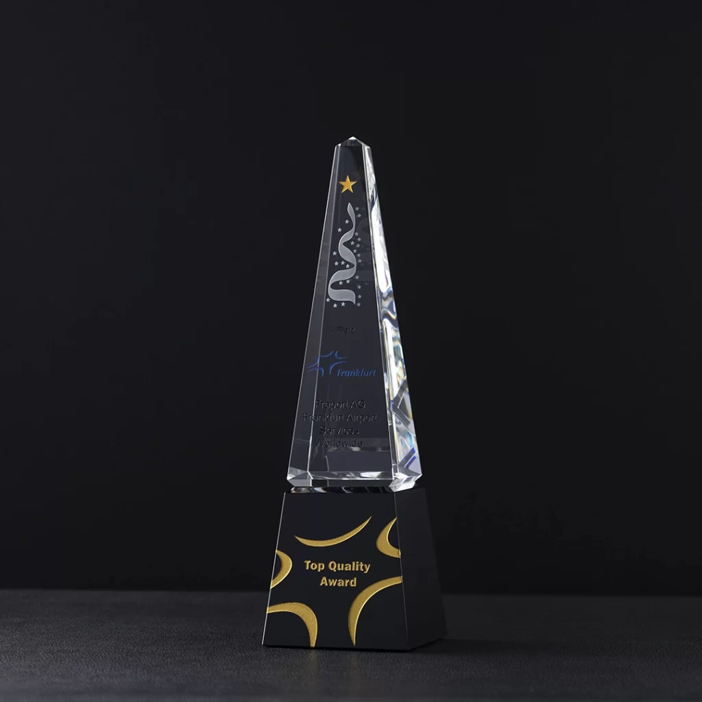 laser engraving crystal award in the shape of triangle