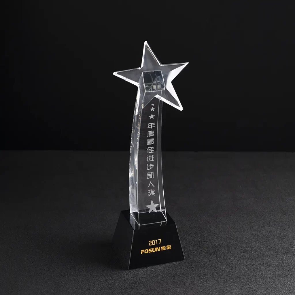 crystal award in the shape of star with black base