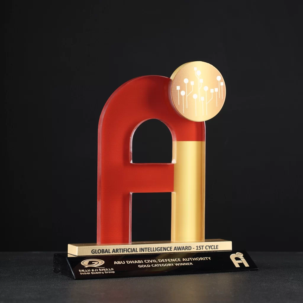 Custom 'Ai'-shaped crystal award with red and golden finish on a black base, designed for the Global Artificial Intelligence Award by Dubai Quality Group.