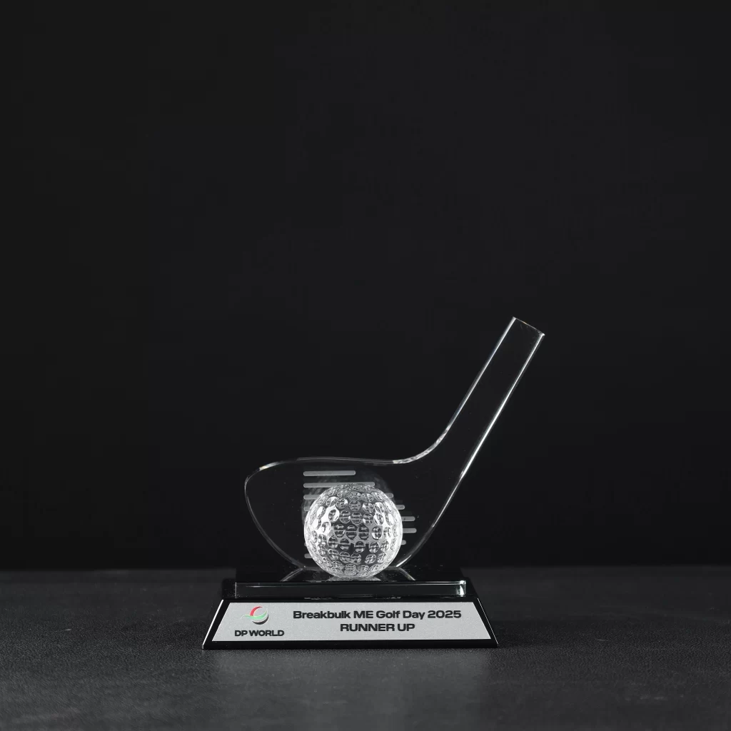 Custom golf-themed crystal trophy with black base and metal plate, designed for DP World—ideal for golf and sports award events.