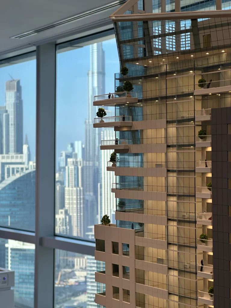 BNW architectural scale model showing a modern high-rise façade with glass balconies, terraces and detailed lighting.