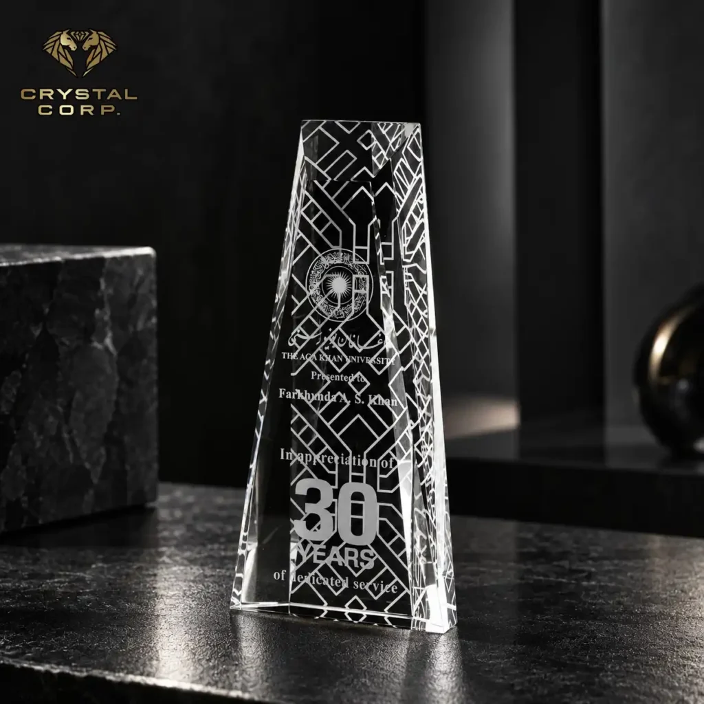Personalized crystal trophy for 30 years of service at Aga Khan University