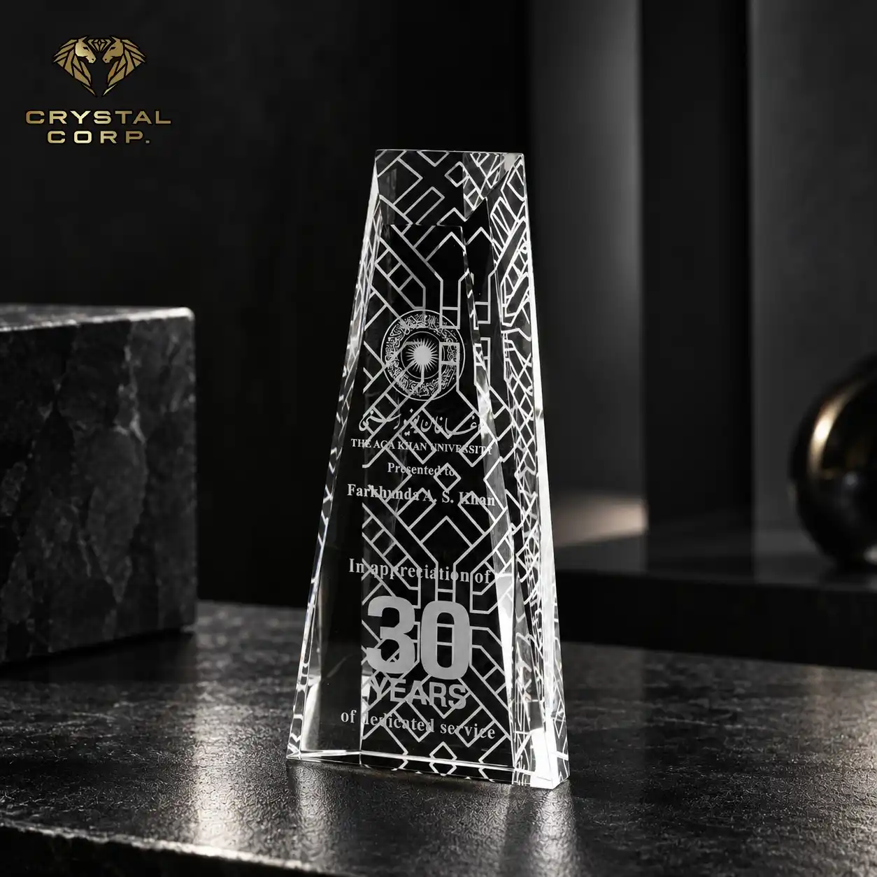 Personalized crystal trophy for 30 years of service at Aga Khan University